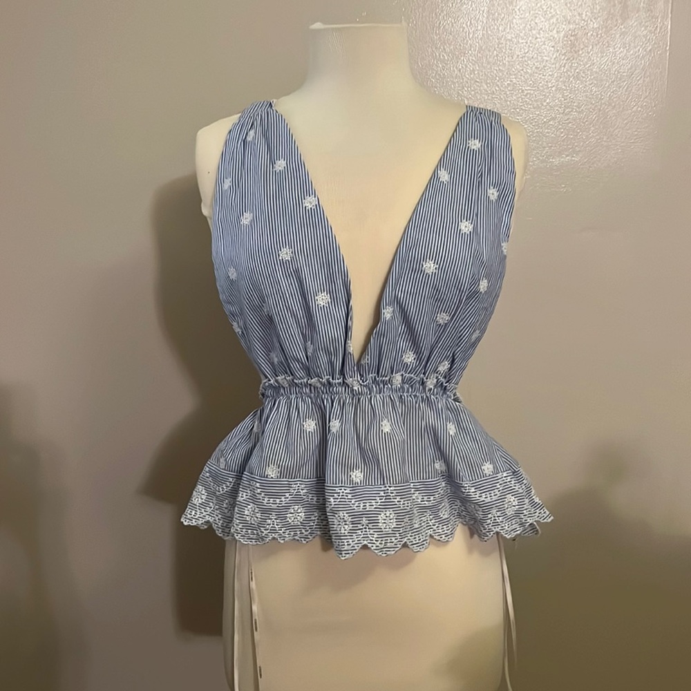 Open back, deep plunge, ruffle tank top